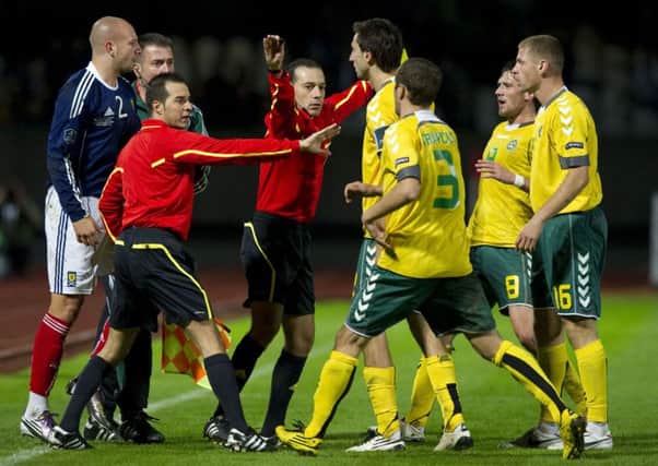 A clash between four Lithuanian internationals, including ex-Hearts winger Kestutis Ivaskevicius (right), and Alan Hutton in 2010. Picture: SNS