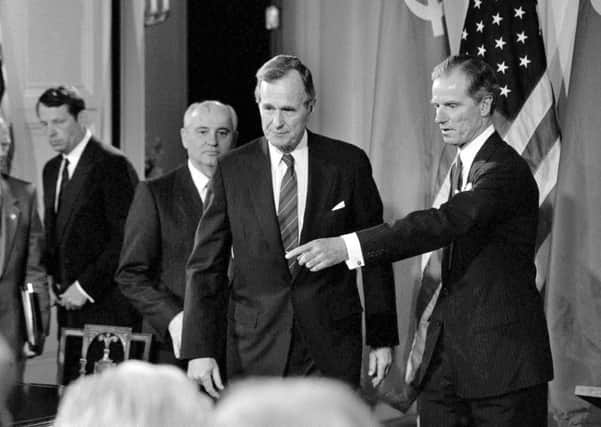 Joseph Verner Reed Jr, right, with President George Bush and Mikhail Gorbachev at a 1990 summit in Washington