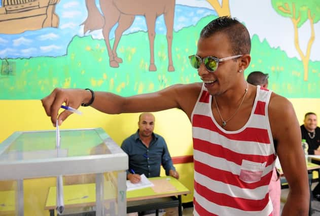 A Moroccan man casts his vote during the parliamentary elections at a polling station in the capital Rabat. Picture: Getty