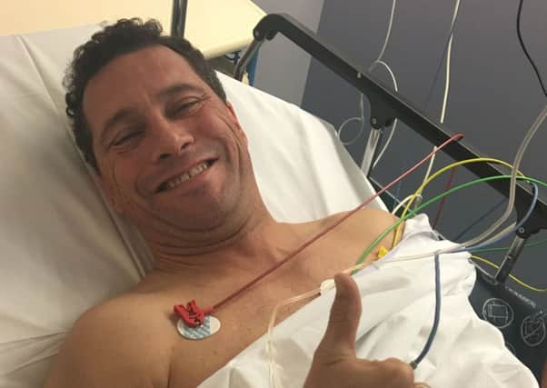 Steve Woolfe giving a thumbs up from his bed yesterday at Hopital De Hautepierre in Strasbourg. Picture: PA