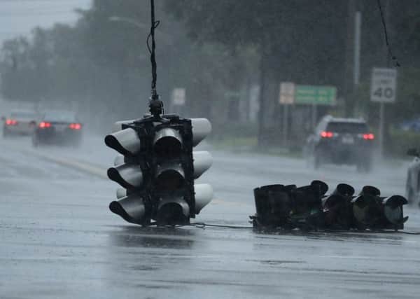 A traffic light hangs in an intersection as Hurricane Matthew moves through Jacksonville. Picture: AP