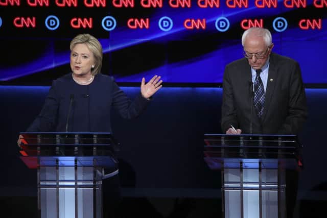 Hillary Clinton and Bernie Sanders during the Democratic presidential debate in Flint, Michigan.