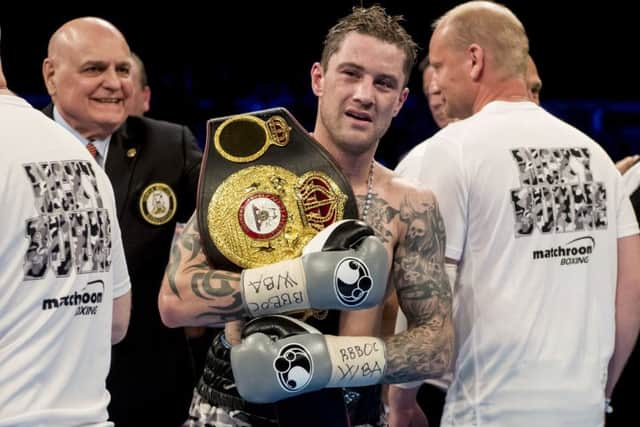 Ricky Burns celebrates the sucessful defence of his world super lightweight title against Kiryl Relikh. Picture: Craig Williamson/SNS