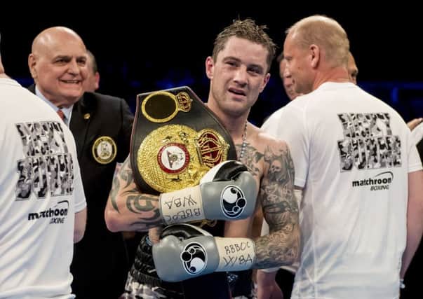 Ricky Burns celebrates the sucessful defence of his world super lightweight title against Kiryl Relikh. Picture: Craig Williamson/SNS
