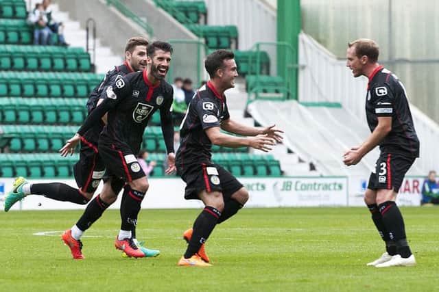 St Mirren's Stephen Mallan (centre) celebrates scoring the equaliser. Picture: SNS