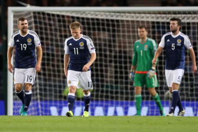 A dejected Scotland after Lithuania take the lead at Hampden. Picture: PA