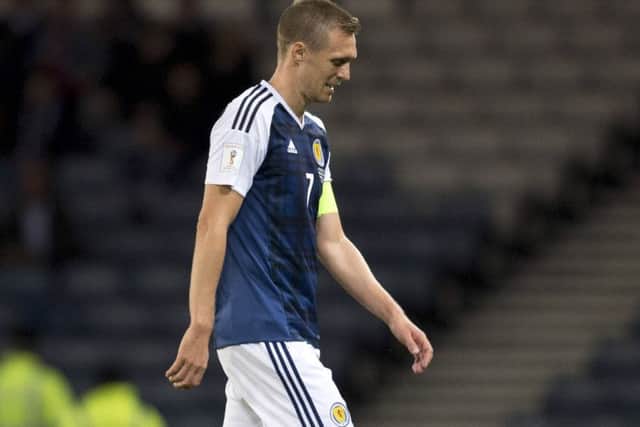 An injured Darren Fletcher trudges off at half-time. Picture: Rob Casey/SNS