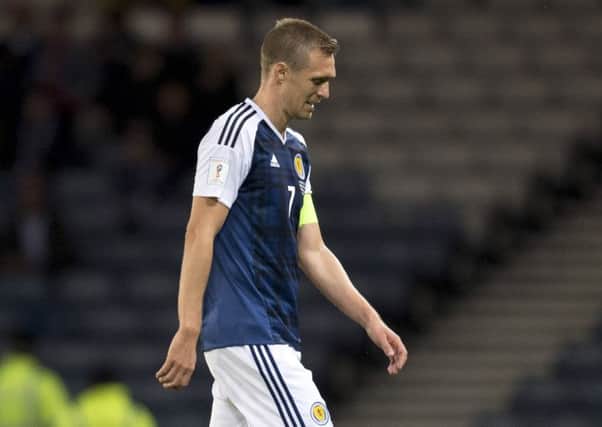 An injured Darren Fletcher trudges off at half-time. Picture: Rob Casey/SNS