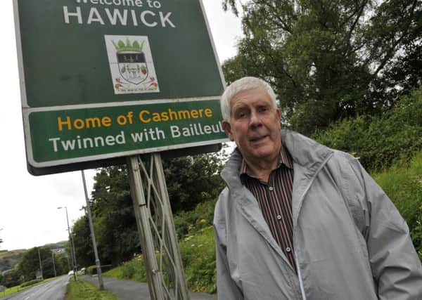 Councillor Ron Smith with Hawicks twin town sign, Bailleul
