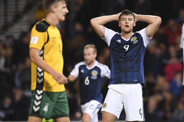 Scotland's Chris Martin cuts a dejected figure after squandering a couple of chances in the draw with Lithuania. Picture: Craig Williamson/SNS