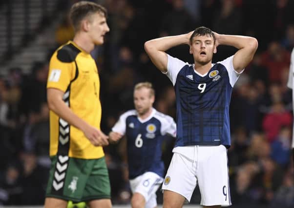 Scotland's Chris Martin cuts a dejected figure after squandering a couple of chances in the draw with Lithuania. Picture: Craig Williamson/SNS