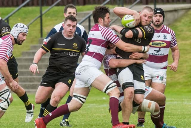Watsonians' Matt Poole and Ruaridh Knott of Melrose in action. Picture: Ian Georgeson