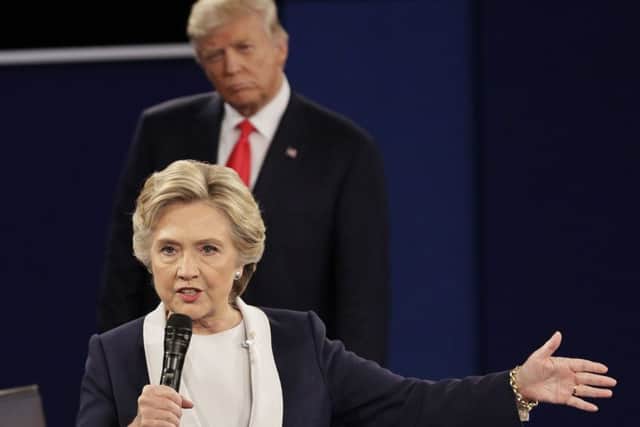 Donald Trump listens to Hillary Clinton during the second presidential debate. Picture: AP