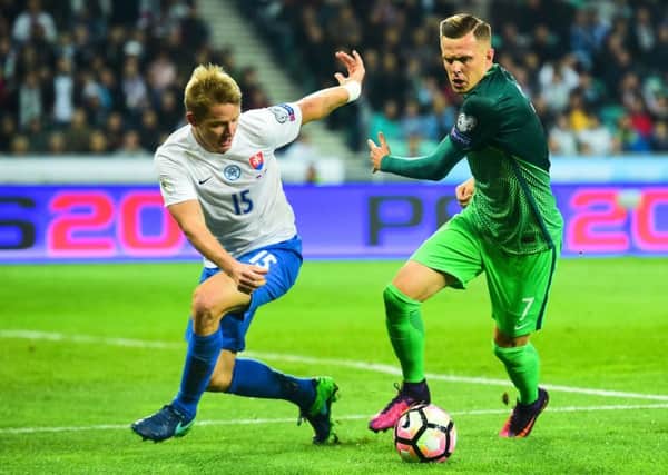 Slovakia's Tomas Hubocan vies for the ball with Slovenia's Josip Ilicic. Picture: AFP/Getty Images