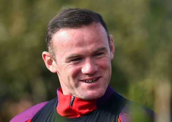 Wayne Rooney has been dropped to the substitutes bench for England's meeting with Slovenia. Picture: AFP/Getty
