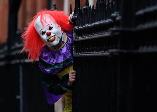 The clown followed and threatened to slit a woman's throat. Picture: PA