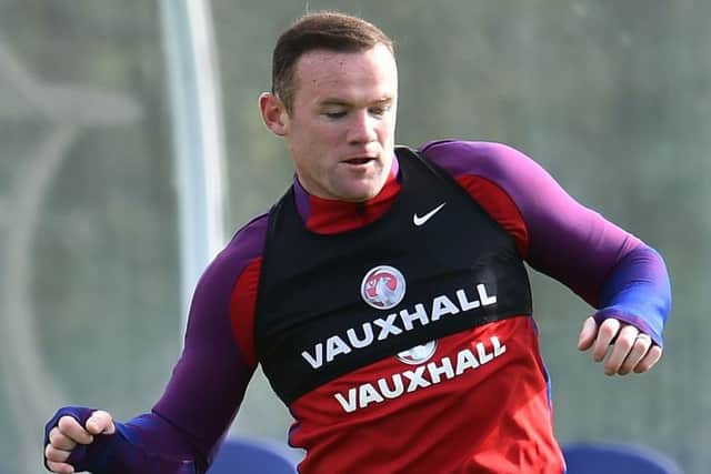 Wayne Rooney remains the England captain, according to stand-in boss Gareth Southgate, despite being dropped for the Slovenia game. Picture: Glyn Kirk/AFP