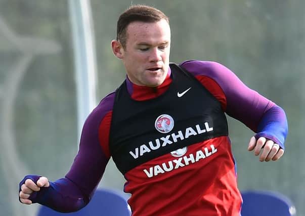 Wayne Rooney remains the England captain, according to stand-in boss Gareth Southgate, despite being dropped for the Slovenia game. Picture: Glyn Kirk/AFP