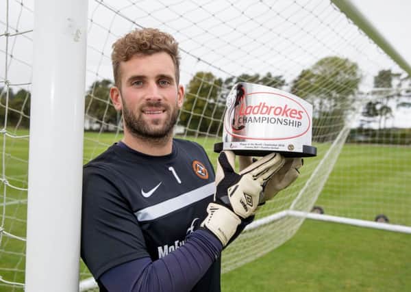 Dundee United's Cammy Bell with the Ladbrokes Championship Player of the Month Award for September. Picture: Kenny Smith/SNS