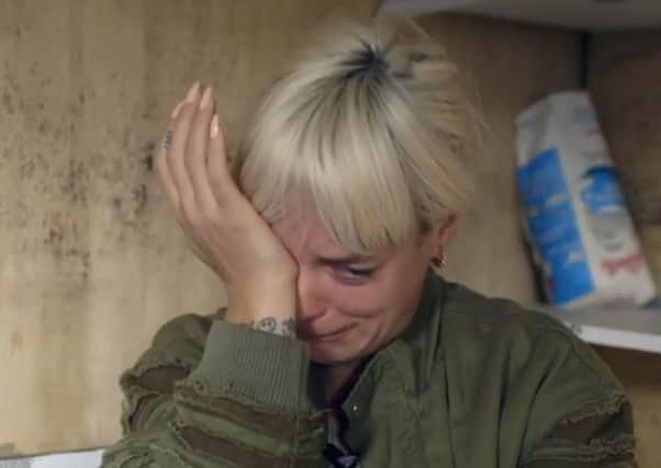 Lily Allen breaks down in tears as she meets a 13-year-old boy from Afghanistan during her visit to the Calais camp. Picture: PA