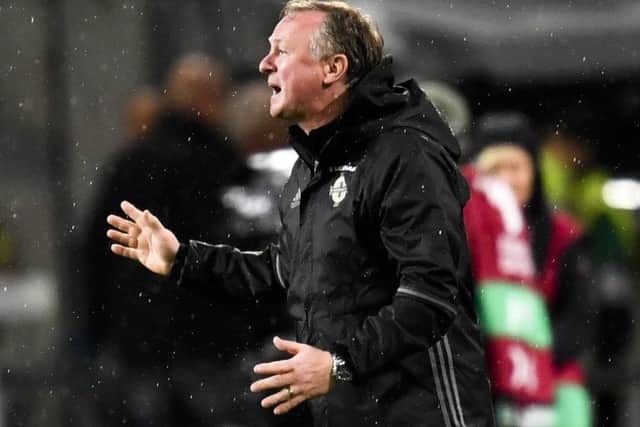 Northern Ireland coach Michael O'Neill gestures on the sideline during the World Cup Group C qualifier against Germany. Picture: Martin Meissner/AP