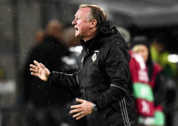 Northern Ireland coach Michael O'Neill gestures on the sideline during the World Cup Group C qualifier against Germany. Picture: Martin Meissner/AP