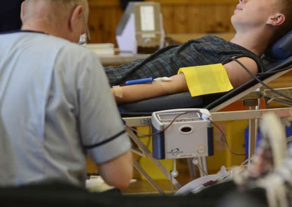 Sexually active gay men are currently banned from giving blood. Picture: Julie Bull