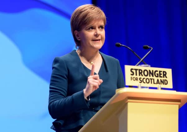 Nicola Sturgeon addresses the SNP autumn conference at the SECC in Glasgow. Picture: SWNS