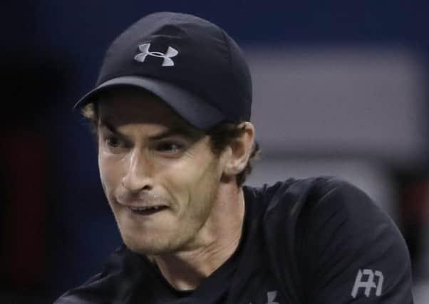 Andy Murray hits a return shot against Lucas Pouille in Shanghai. Murray won 6-1, 6-3. Picture: Andy Wong/AP