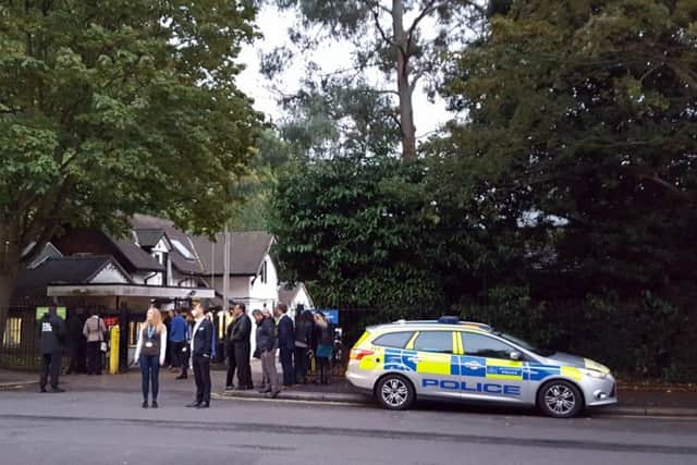 Police and evacuated visitors outside London Zoo
