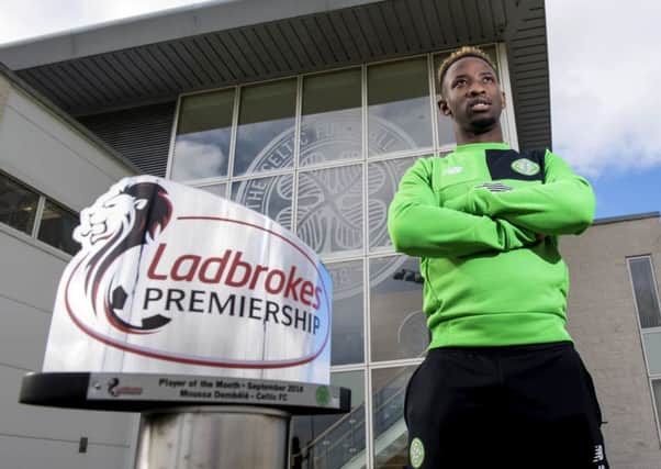 Celtic's Moussa Dembele with the Ladbrokes Premiership player of the month award for September. Picture: Craig Williamson/SNS