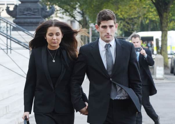 Footballer Ched Evans, right, and partner Natasha Massey leave Cardiff Crown Court where he has been found not guilty of rape following a two week retrial. Picture: Ben Birchall/PA Wire