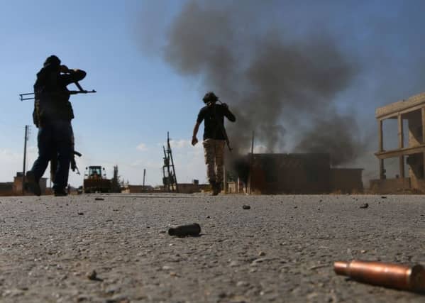 Fighters from the Free Syrian Army fight against the Islamic State (IS) group jihadists on the outskirts of the northern Syrian town of Dabiq. Picture: Getty