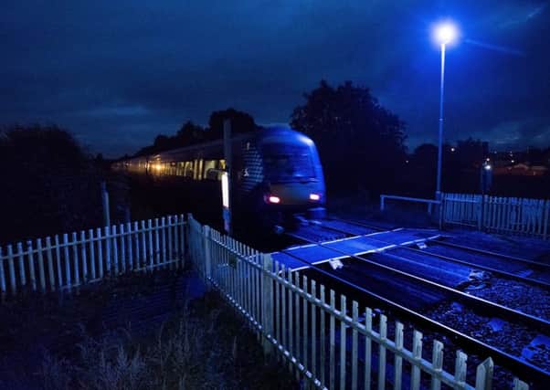 The level crossing on the railway at Millhall Road, Stirling, with the blue light in place that aims to deter people from attempting suicide. Picture: Andrew OBrien