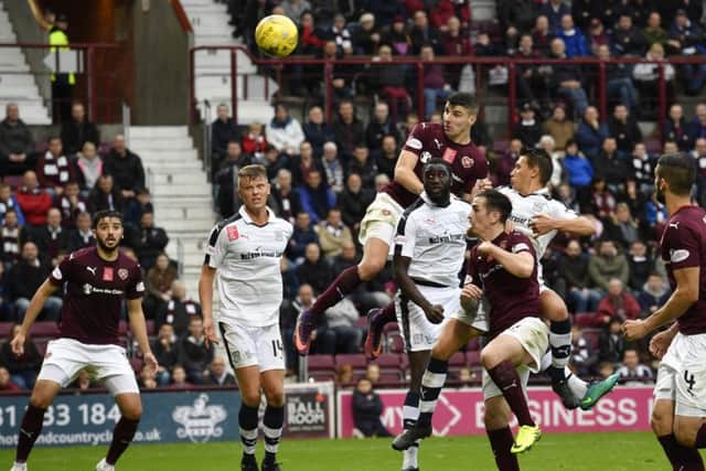 Callum Paterson's towering header gave Hearts the lead in the second half. Picture: SNS