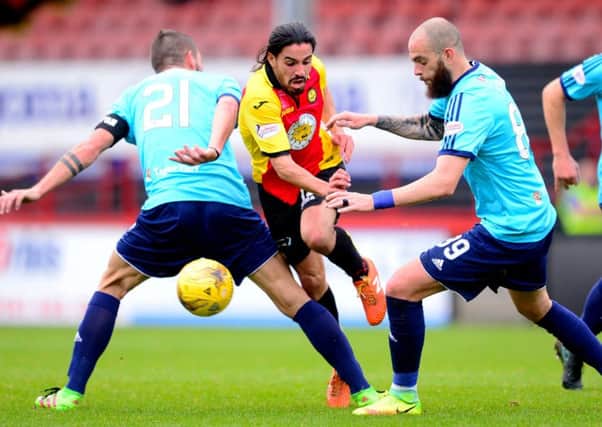 Partick Thistle's Ryan Edwards gets away from Hamilton's Massimo Donati and Georgio Sarris. Picture: Bill Murray/SNS