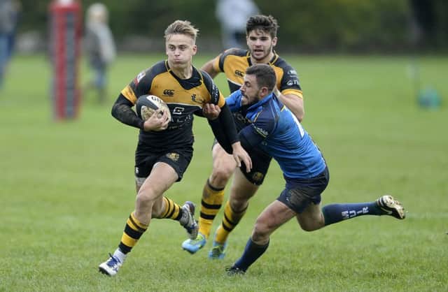 Harvey Elms of Currie is tackled by Chris Laidlaw  of Boroughmuir. Picture:

 Neil Hanna