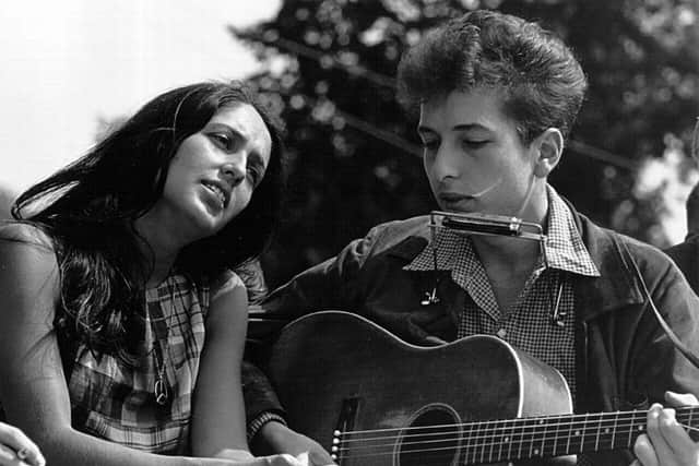 Joan Baez and Bob Dylan perform during a civil rights rally on August 28, 1963 in Washington D.C. Picture: Rowland Scherman/Getty