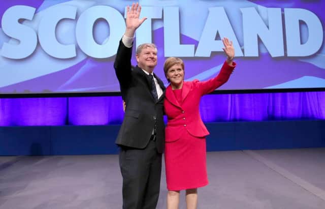 Nicola Sturgeon with SNP deputy leader Angus Robertson after giving her address at the SNP autumn conference in Glasgow. Picture: Jane Barlow/PA Wire
