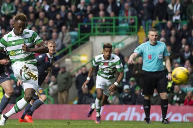 Moussa Dembele converts a late penalty to make the game safe for Celtic on Saturday. Picture: SNS.