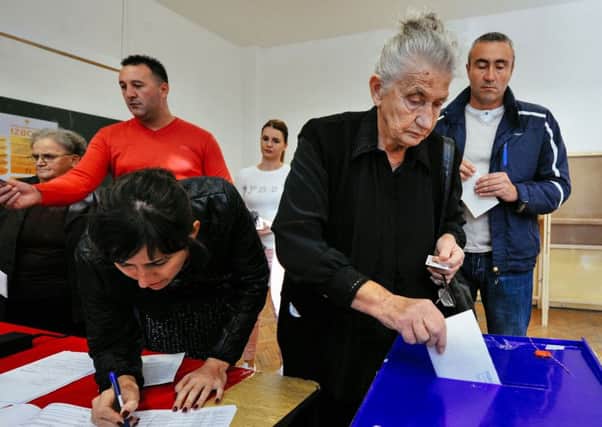 Voting in parliamentary elections began on Saturday with opposition groups hoping to end the rule of pro-Western premier Milo Djukanovic, who warns that his rivals would derail imminent NATO accession.
 Picture: Getty
