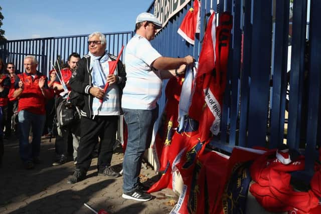 Supporters who had travelled to Paris went to Stade Yves-Du-Manoir to lay scarves and flags in tribute to Anthony Foley. Picture: Getty.