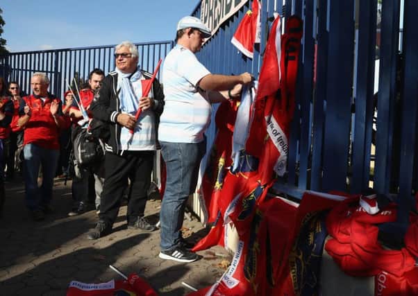 Supporters who had travelled to Paris went to Stade Yves-Du-Manoir to lay scarves and flags in tribute to Anthony Foley. Picture: Getty.