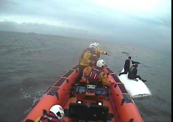 The dinghy had been sailing off the Edinburgh town when they suffered suspected equipment failure causing the mast to fail. Picture: RNLI