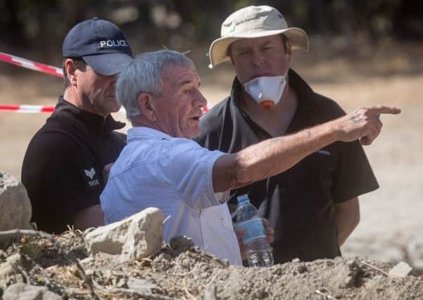 Ben Needham's grandfather, Eddie Needham (in white shirt) talks with South Yorkshire Police officers while touring the search site of missing toddler Ben Needham on October 5, 2016 in Kos, Greece. Picture: Getty Images