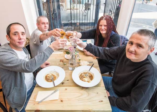 Homeless guests enjoy meal at Maison Bleue. Picture: Ian Georgeson/Contributed