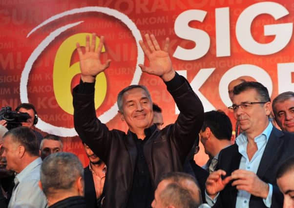 Montenegrin Prime Minister Milo Djukanovic celebrates after parliamentary elections in Podgorica. Picture: AFP/Getty Images
