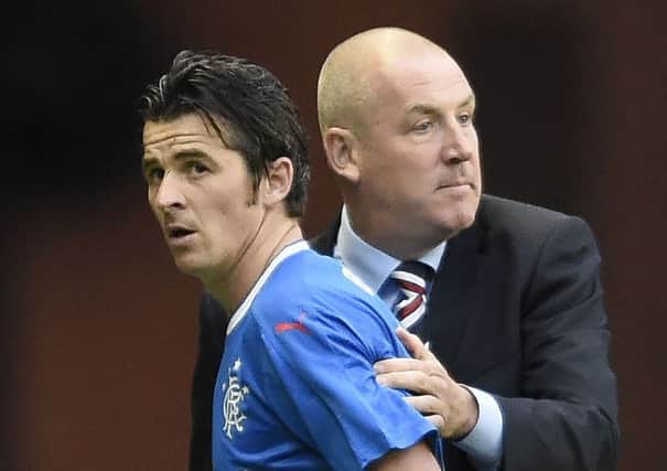 Joey Barton, left, has been absent from the Rangers squad after a bust-up with manager Mark Warburton. Picture: PA