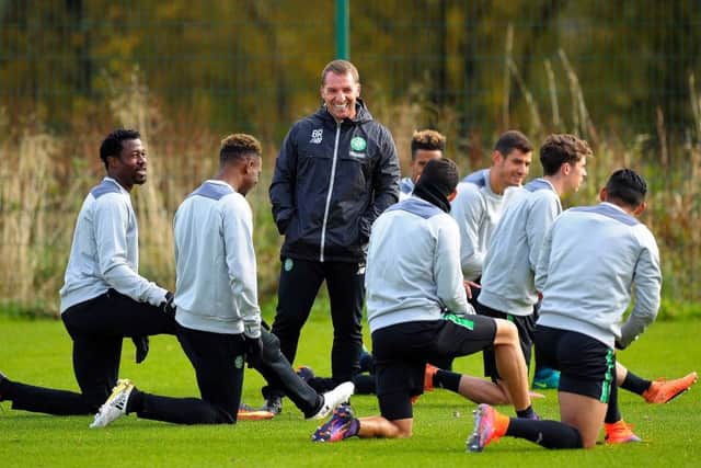 Celtic manager Brendan Rodgers jokes with his players at a training session ahead of their Champions League game against Borussia Monchengladbach. Picture: Andy Buchanan/Getty Images