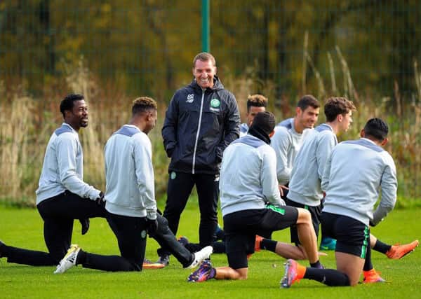 Celtic manager Brendan Rodgers jokes with his players at a training session ahead of their Champions League game against Borussia Monchengladbach. Picture: Andy Buchanan/Getty Images